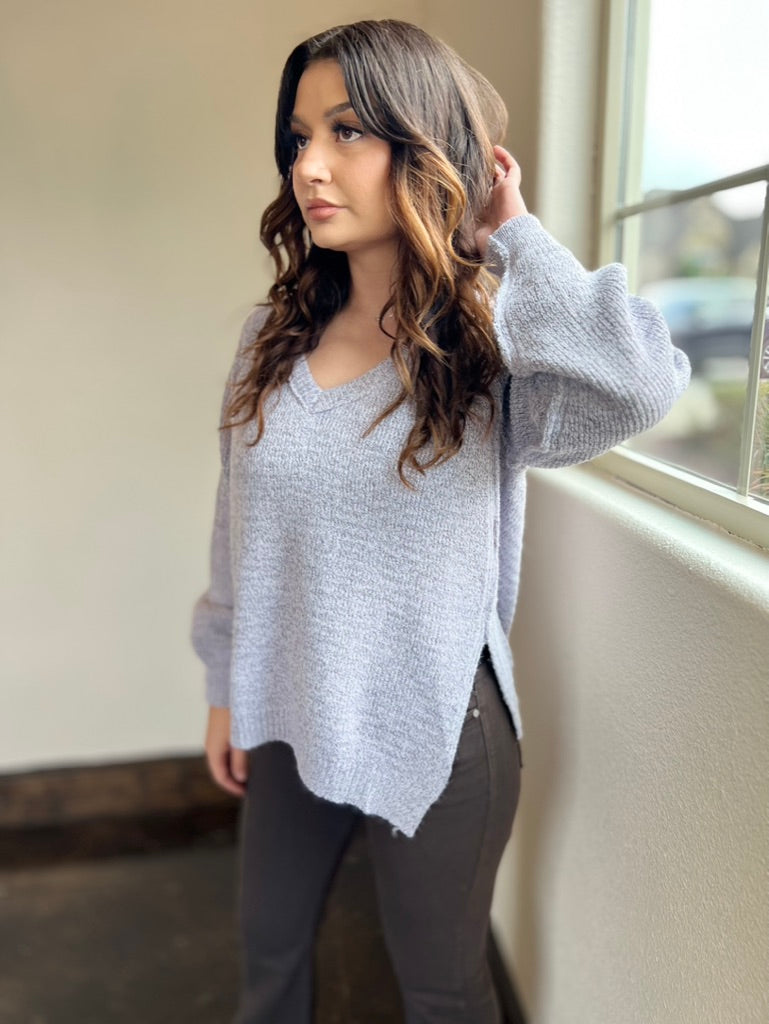 White ruffle sleeves top with tie back.